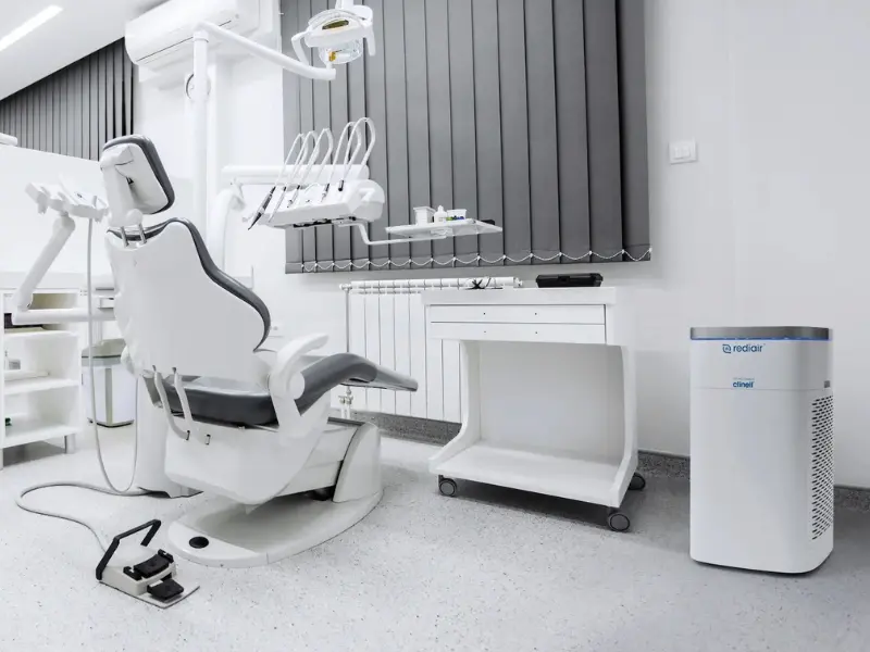 Treatment room with a medical grade air purifier